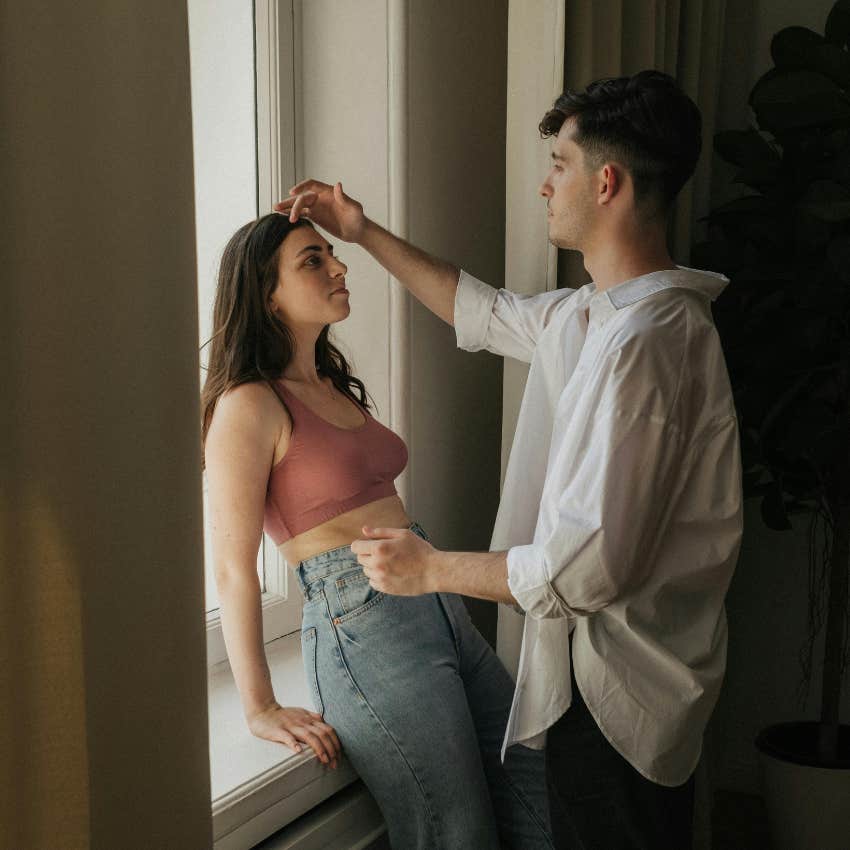 tall man noticing how short a woman is