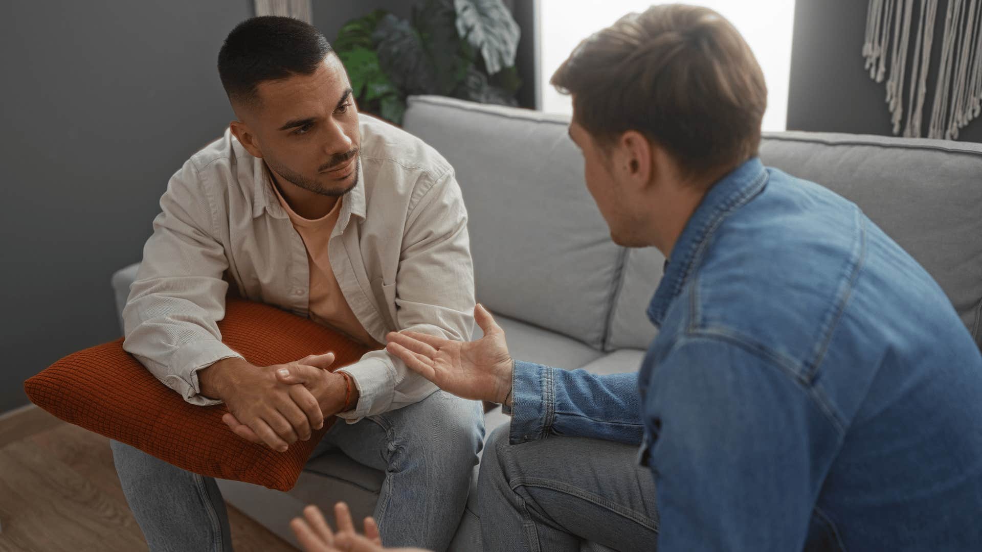gen z man comforting friend over his hardships