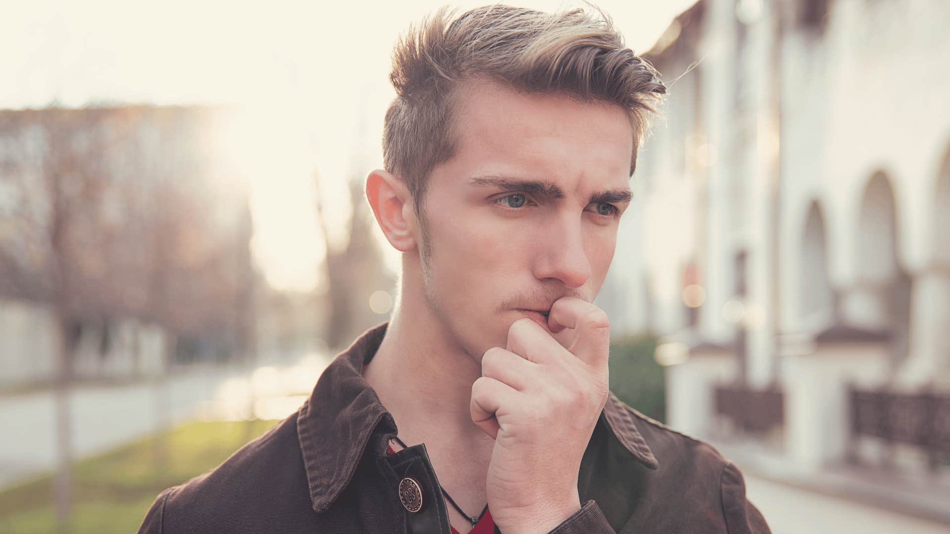 gen z man looking worried about making mistakes