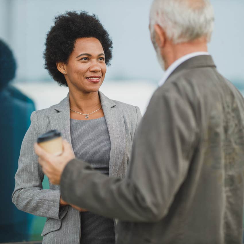confident woman making eye contact with co-worker