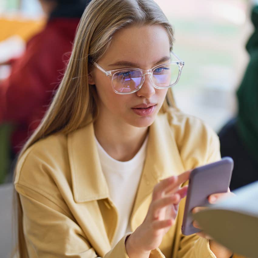 gen z woman on the phone noticing fake news and AI photos