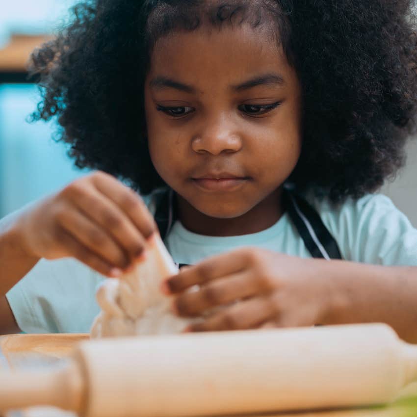 young girl cooking for herself at home