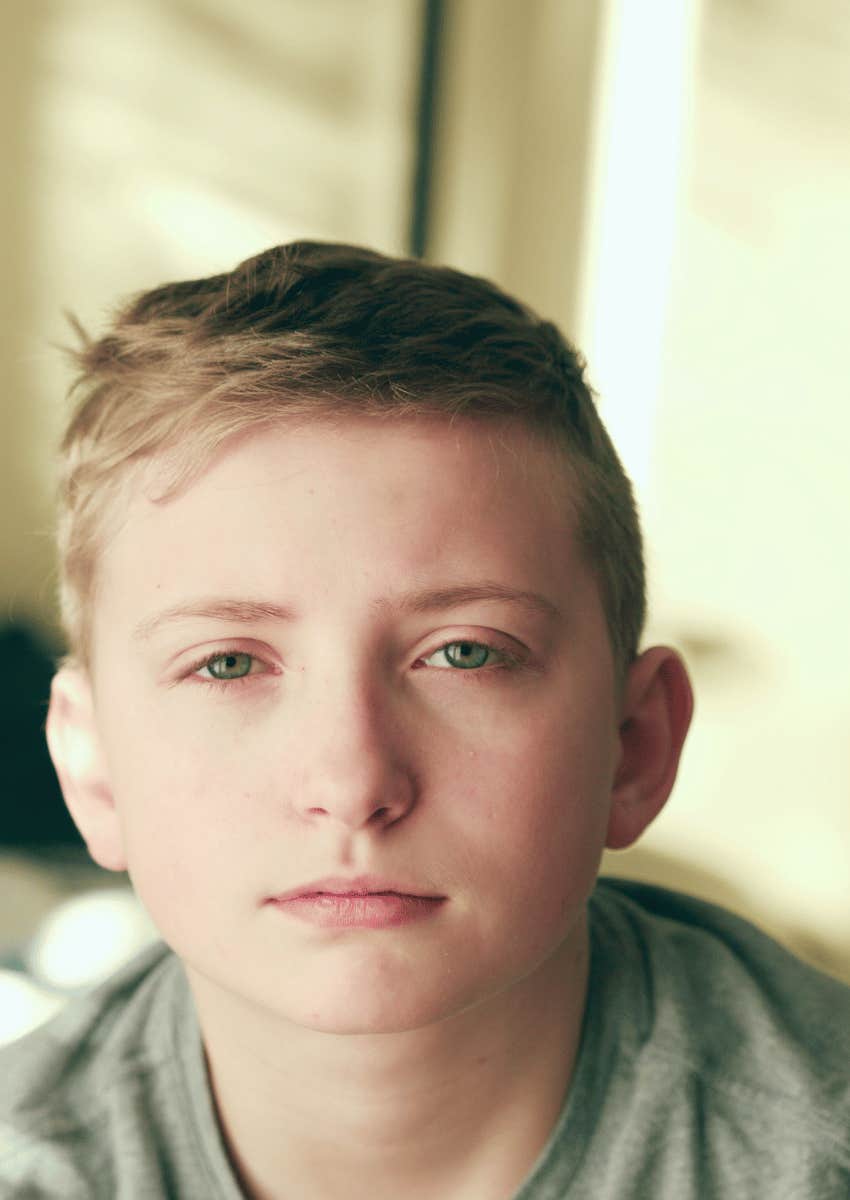 boy with a serious blank expression