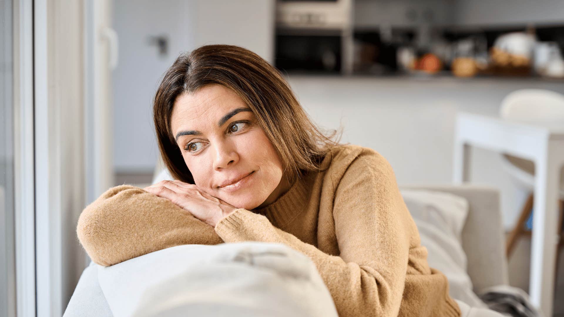 happy intelligent woman taking up space without apologizing