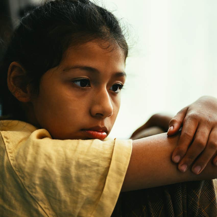 scared little girl facing instability at home