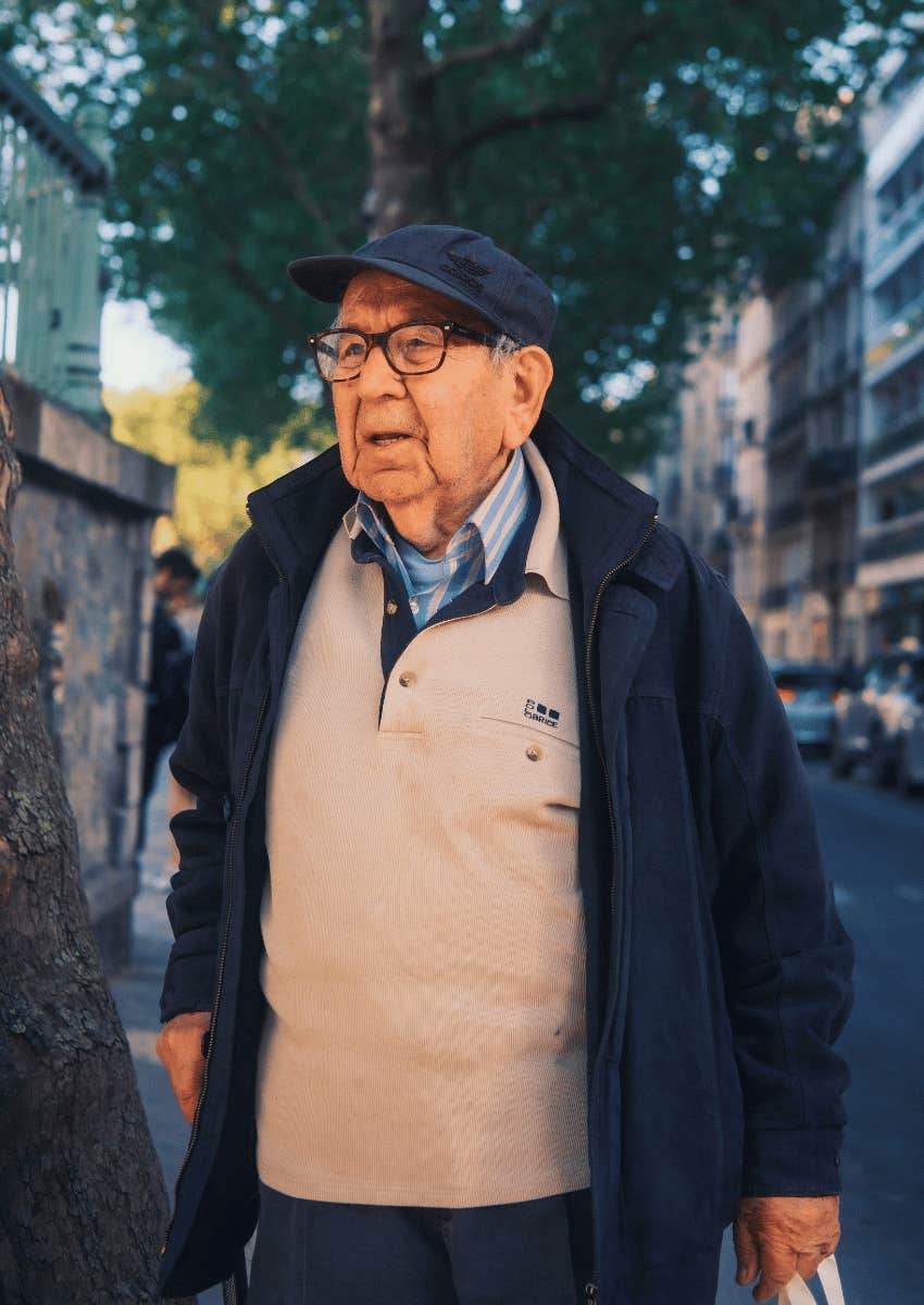 content retired older man standing outside