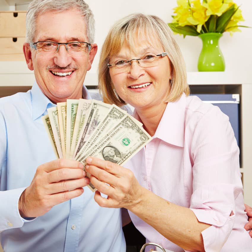 couple holding their money they compromised on