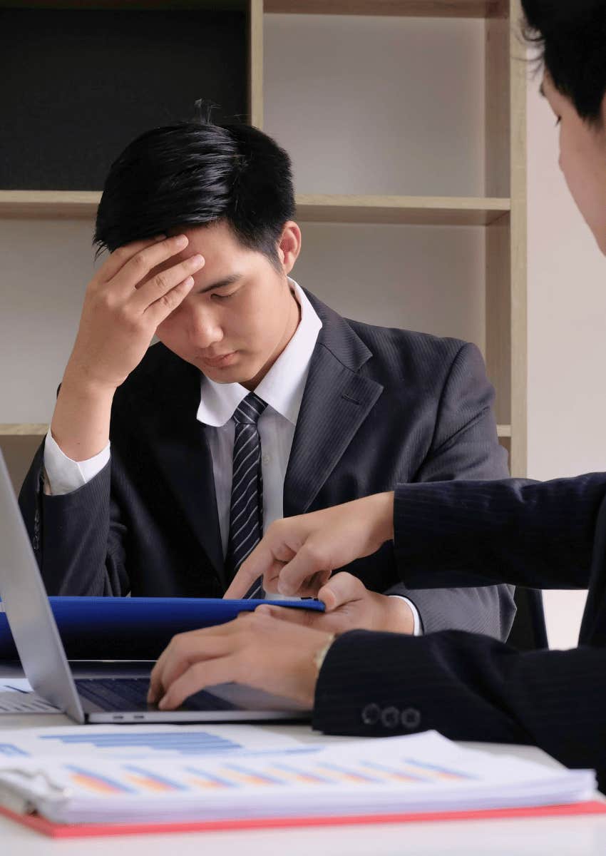 intimidated employee looking down over-apologizing