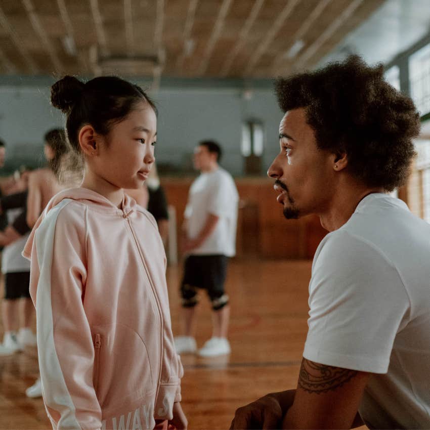 Respectful child making eye contact while speaking with an adult