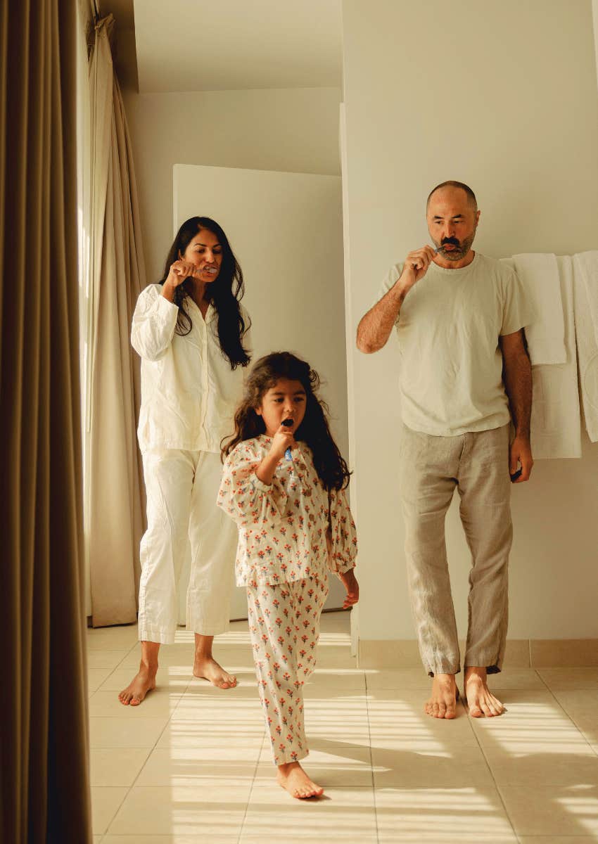 family routine brushing their teeth together