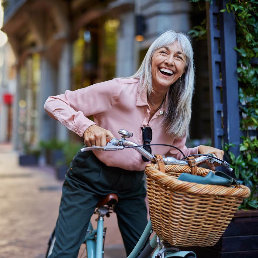 woman indulging in joy and fun on a bike ride