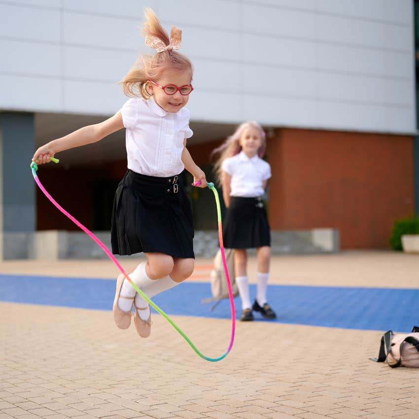 little girl enjoying recess experts insist it's important