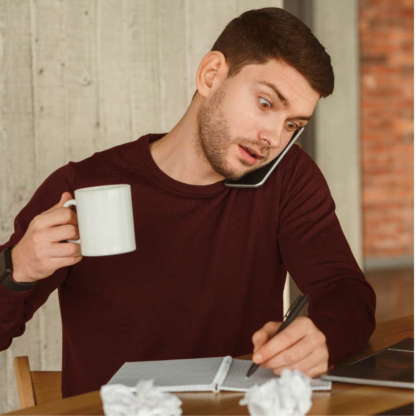 millennial man in hustle culture looking stressed working