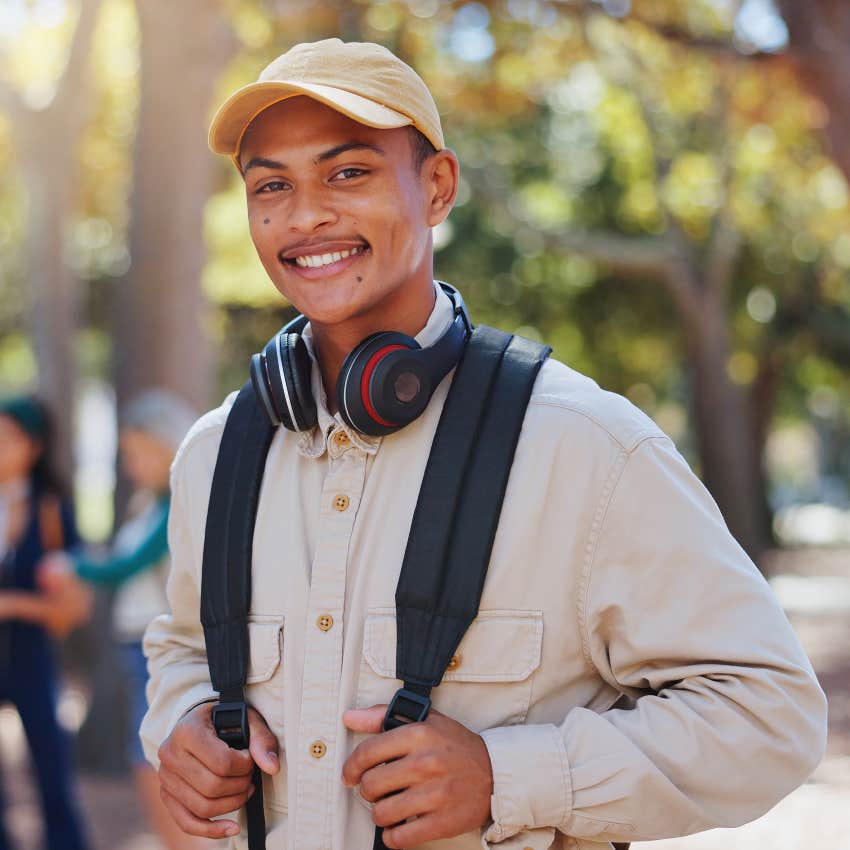 gen z man being a good person standing outside smiling