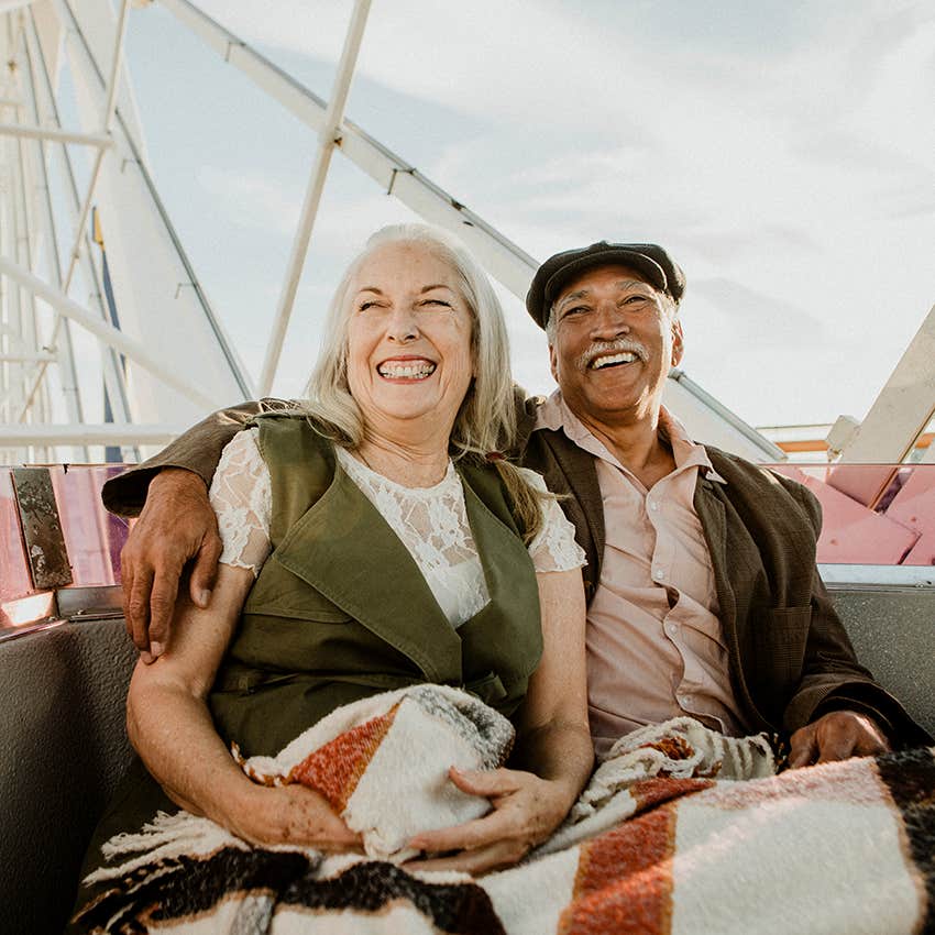 baby boomer retired couple enjoying ferris wheel