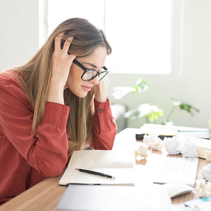 confused woman who thinks she is dumb struggling with her work