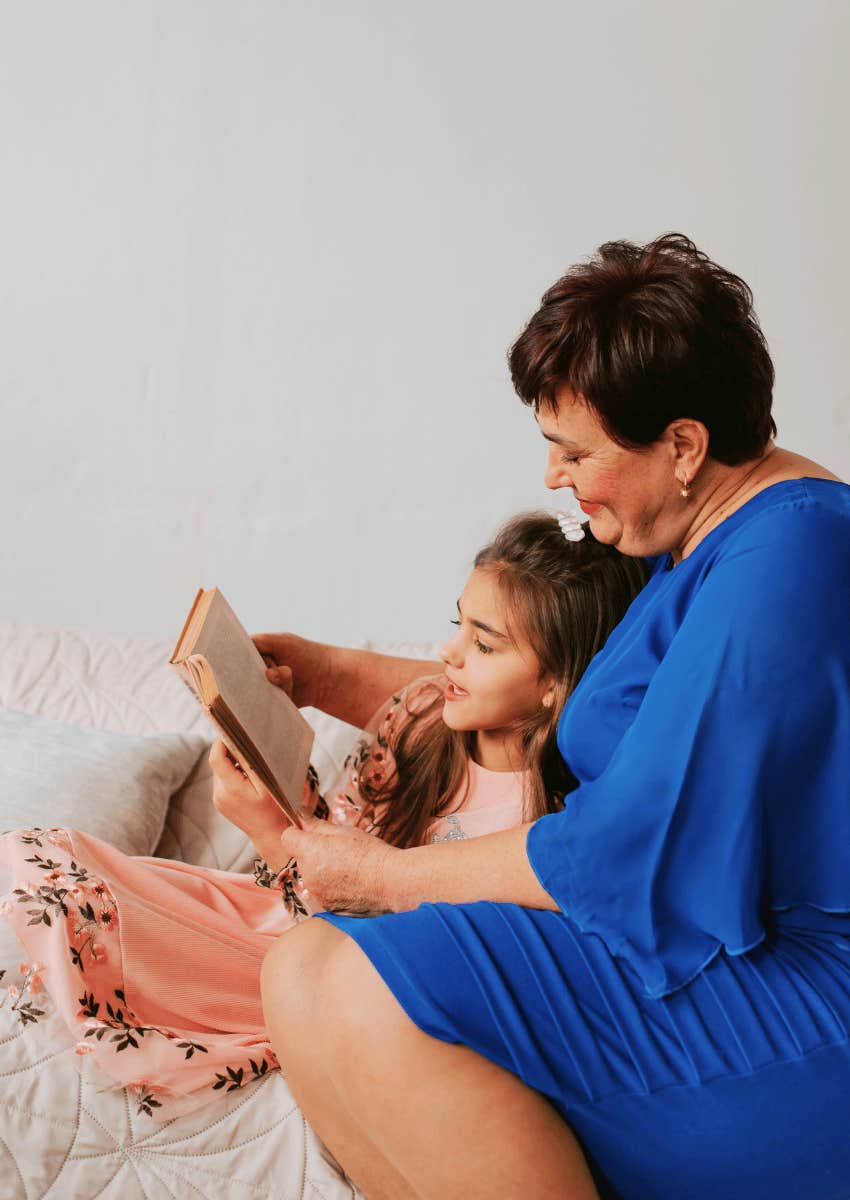 grandparent reading book with grandchild