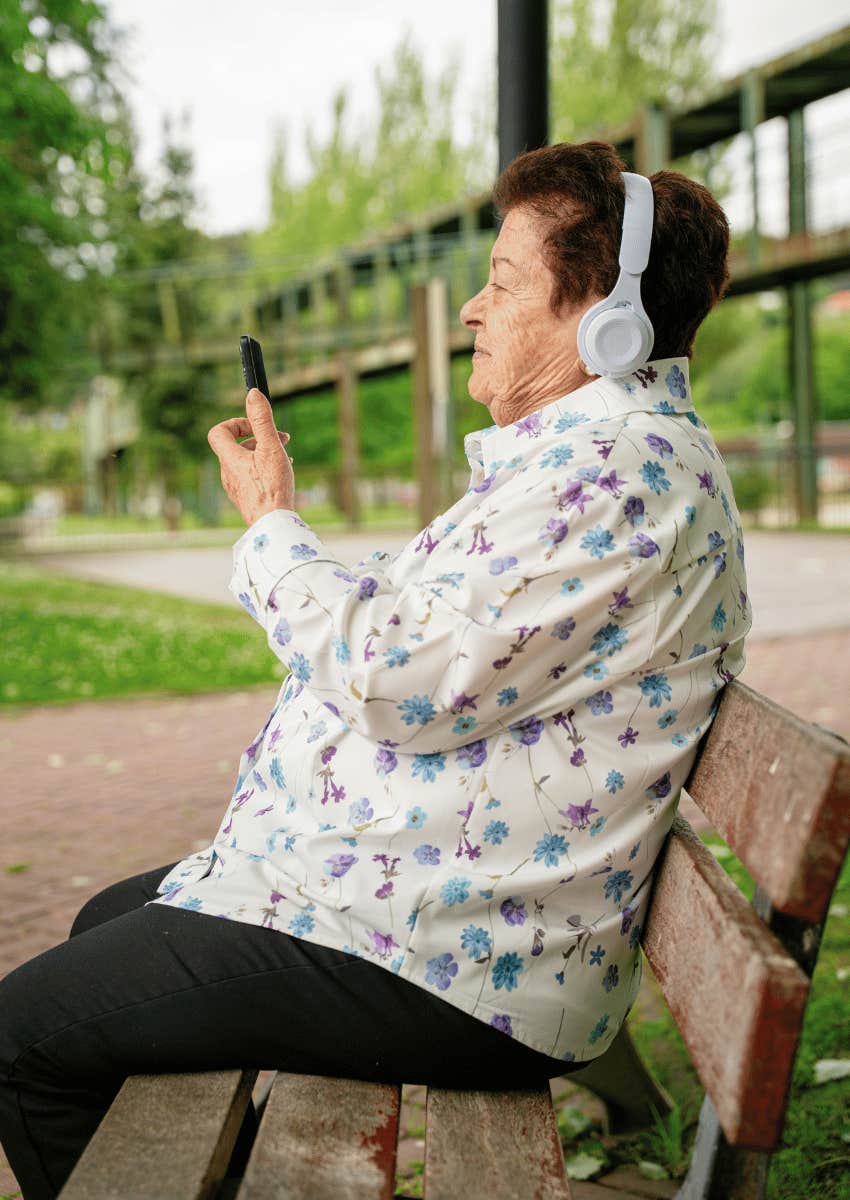 grandparent wearing headphones during video call