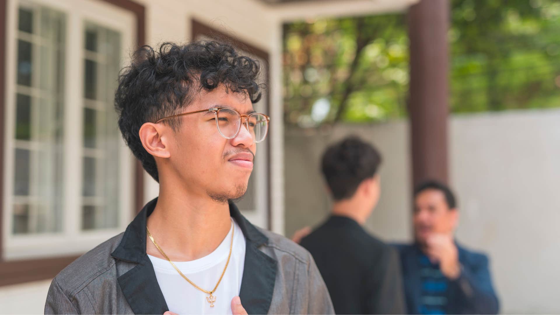 intelligent young man disengaging from stressful situations with family