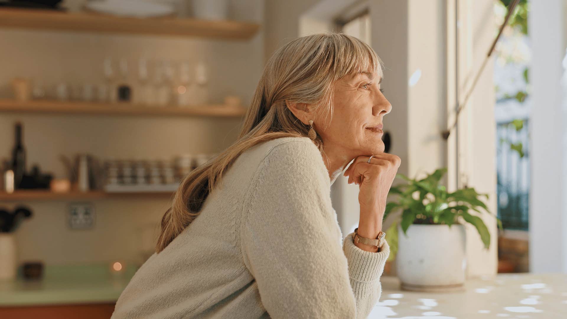 older woman enjoying spending time alone at home