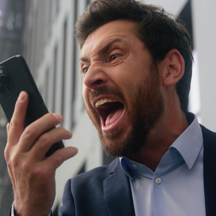 man being aggressive yelling into phone clinging to masculine norms