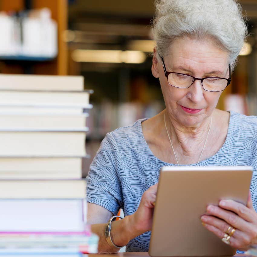 old woman practicing lifelong learning by studying