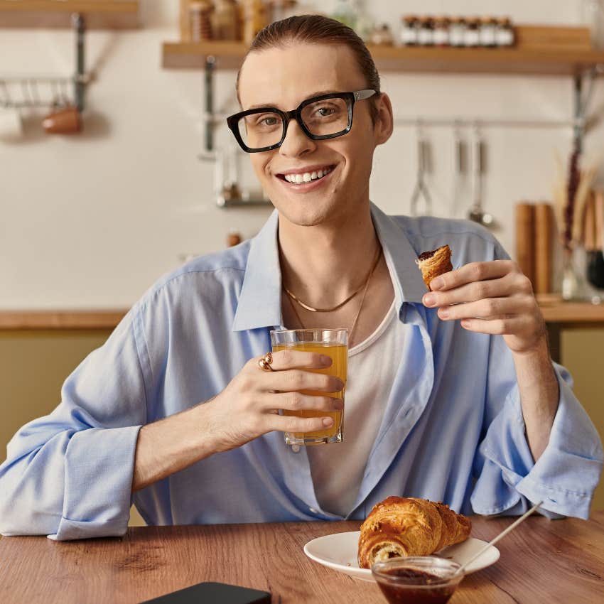 person eating a consistent simple breakfast at home smiling