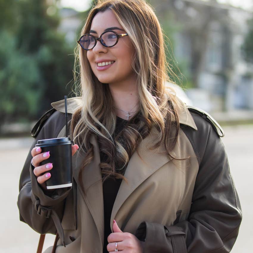 happy woman with coffee running her errands early after waking up
