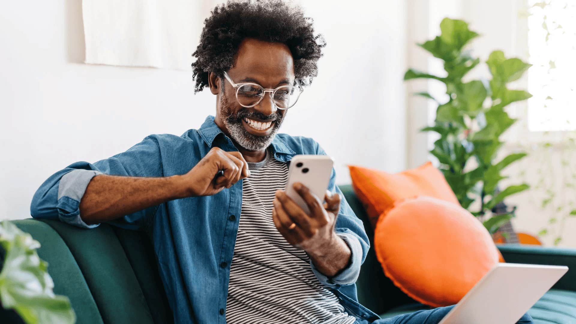 emotionally intelligent man looking at his group chats on phone