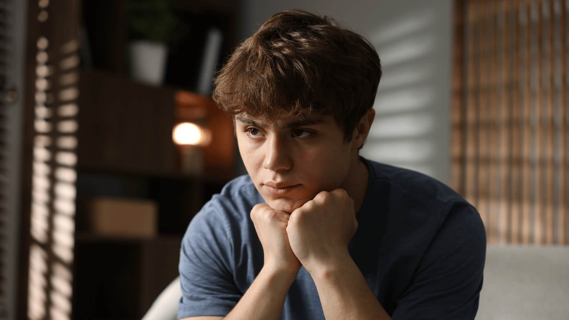 teenage boy feeling sad after being told to respect elders