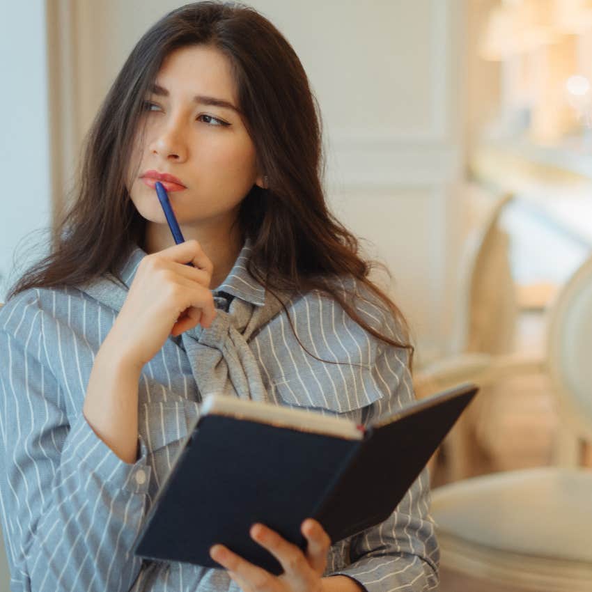 woman clicking a pen