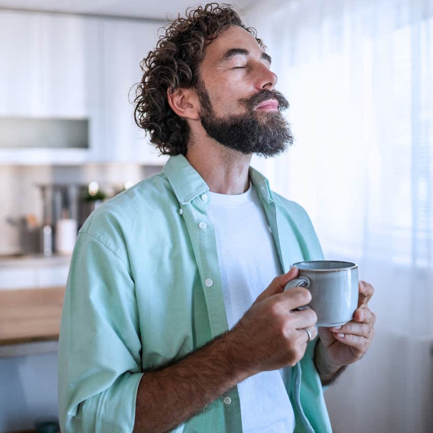 high-iq man preferring alone time at home drinking tea