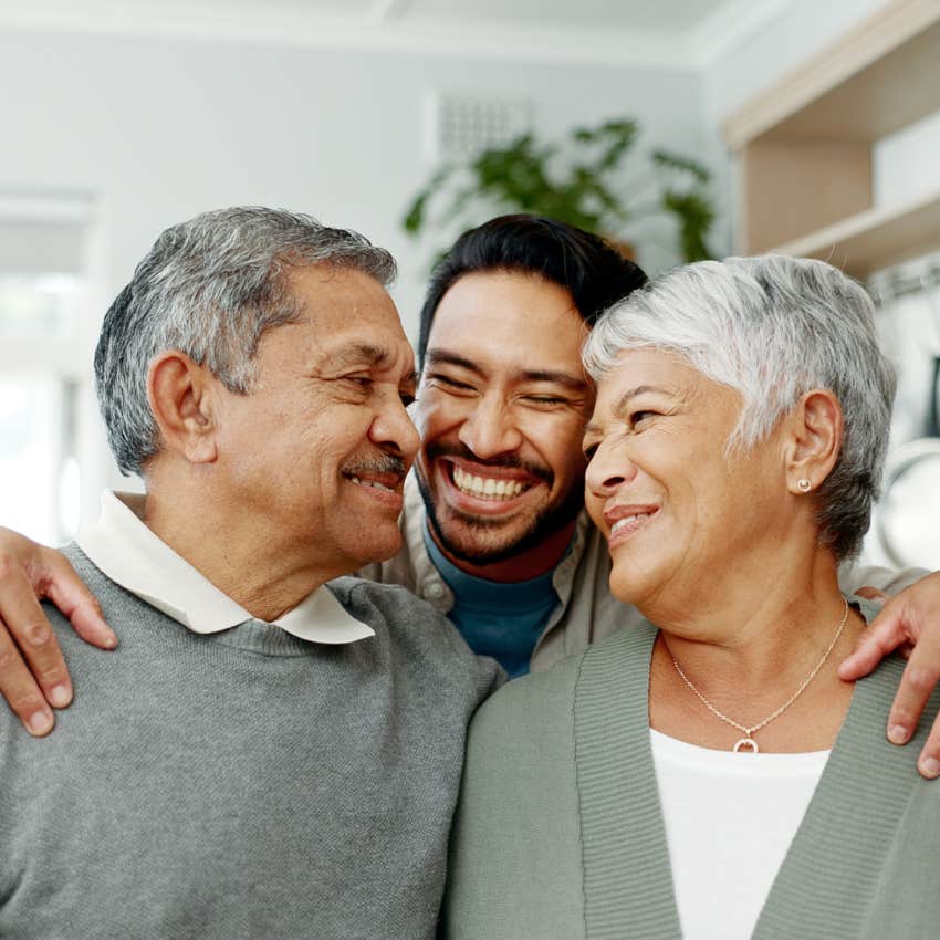 high-value man hugging parents he has a close relationship with
