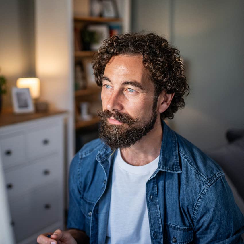 intelligent man considering his own distinct thinking patterns at home