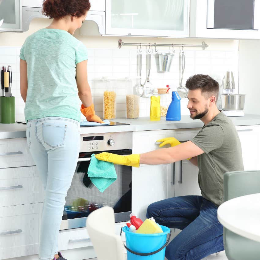 man sharing cleaning responsibilities with wife