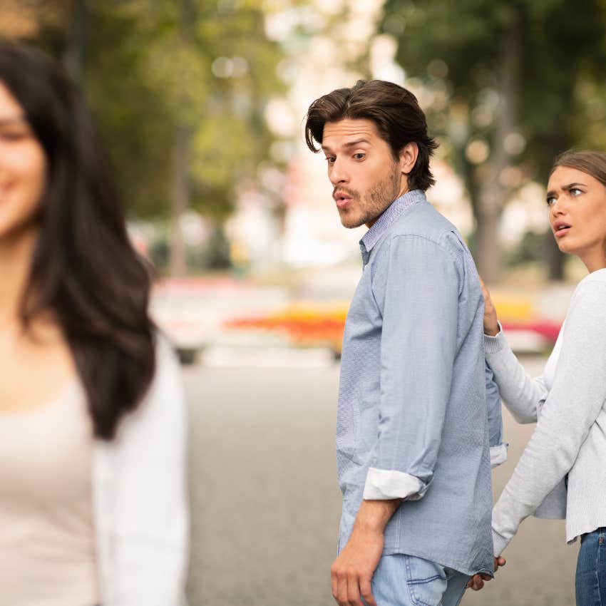 man who believes cheating isn't a bid deal looking at another woman