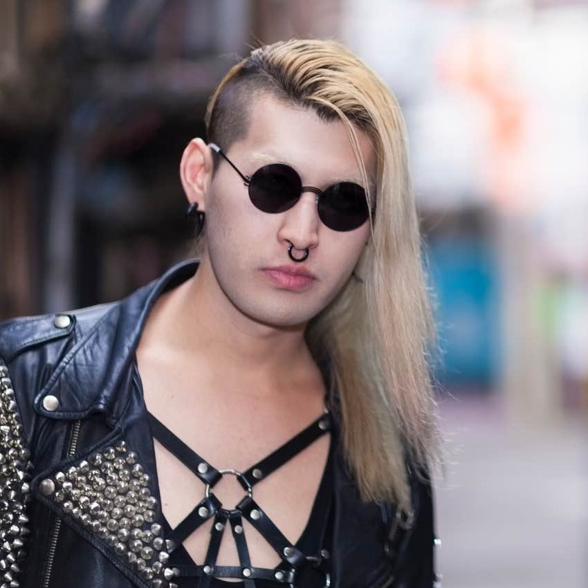 Goth man showing how he likes to dress
