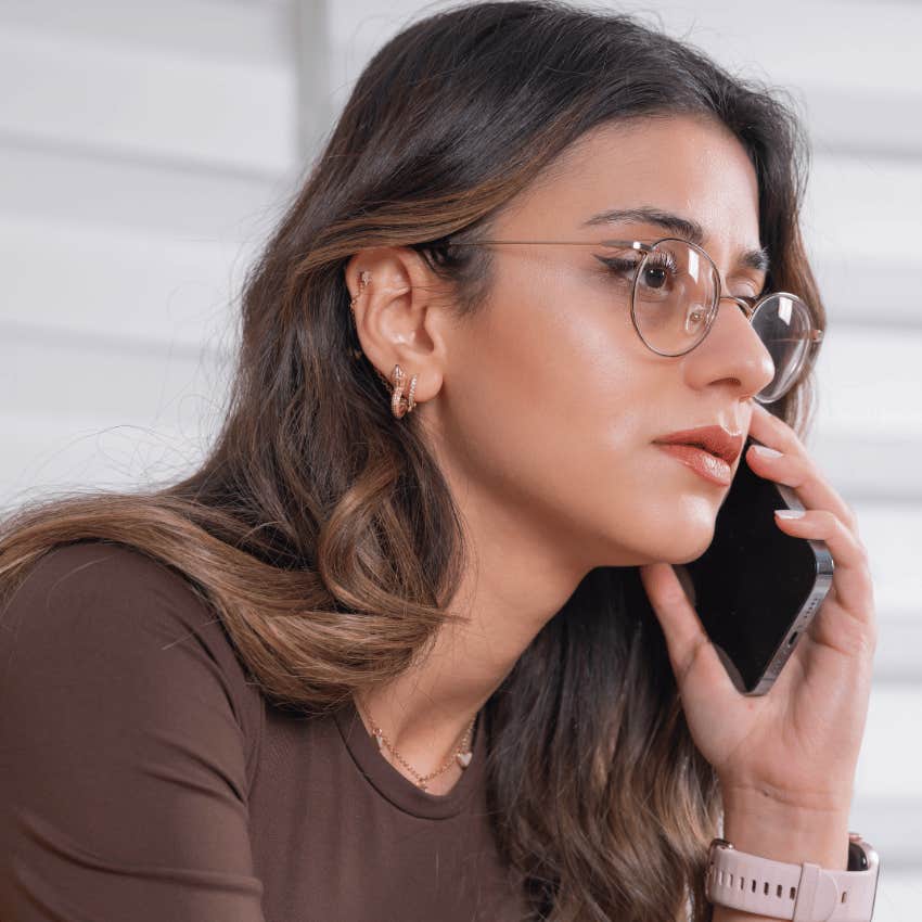 introverted woman on the phone being forced into social plans