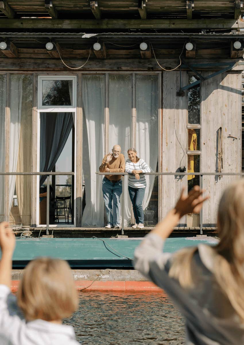 kids waving at their grandparents from a distance