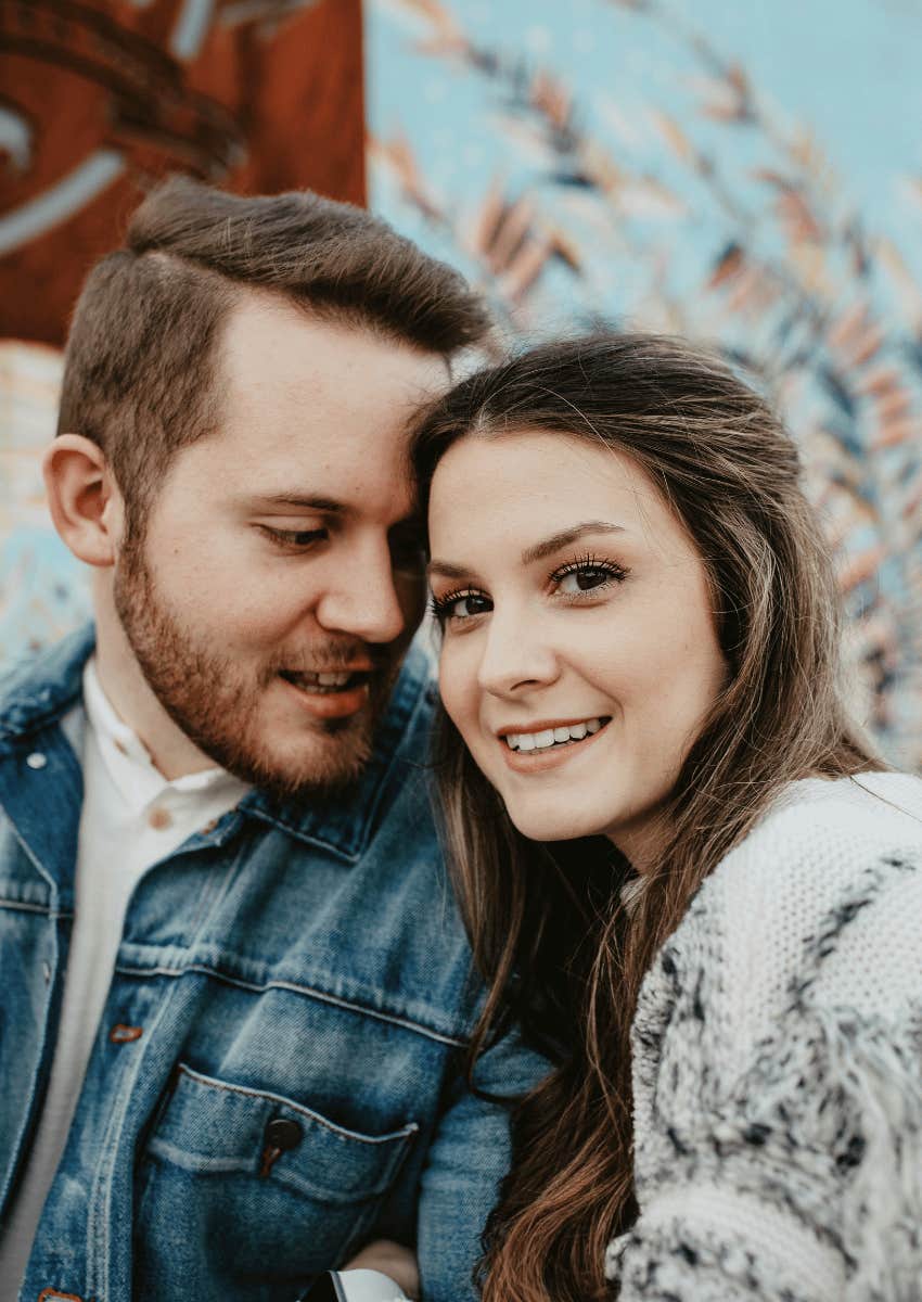 kind woman sitting next to man
