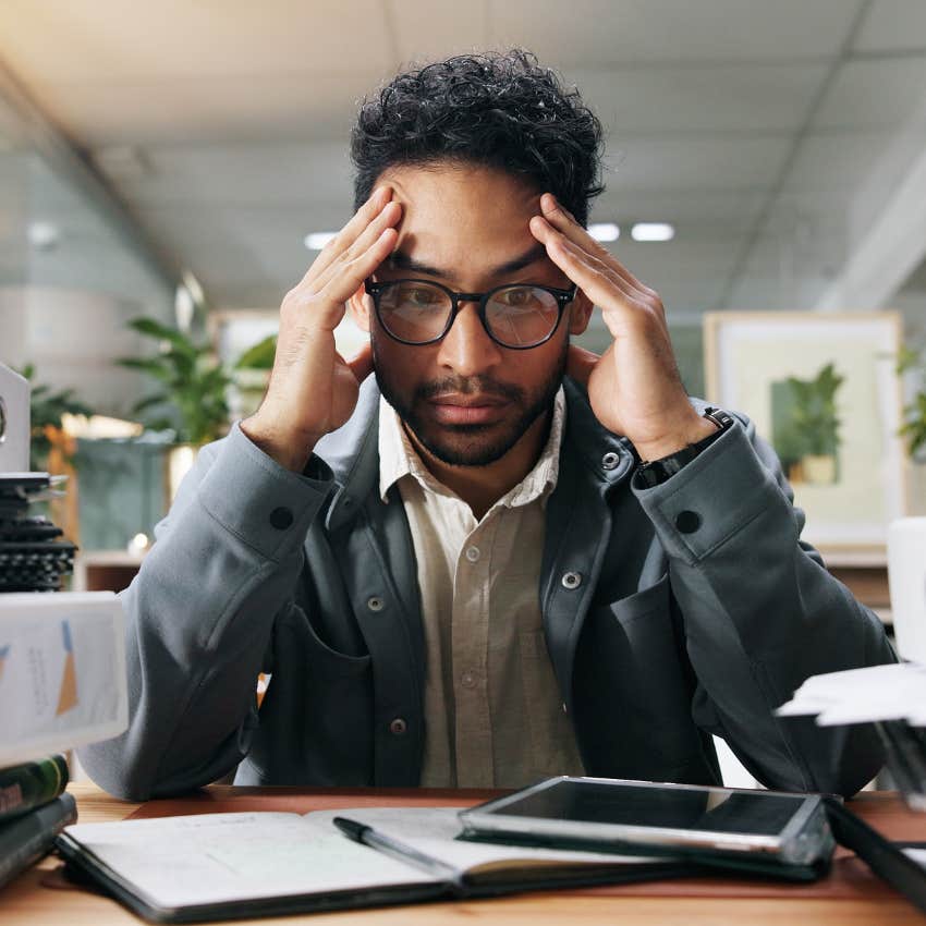 man at work dealing with burnout and looking stressed