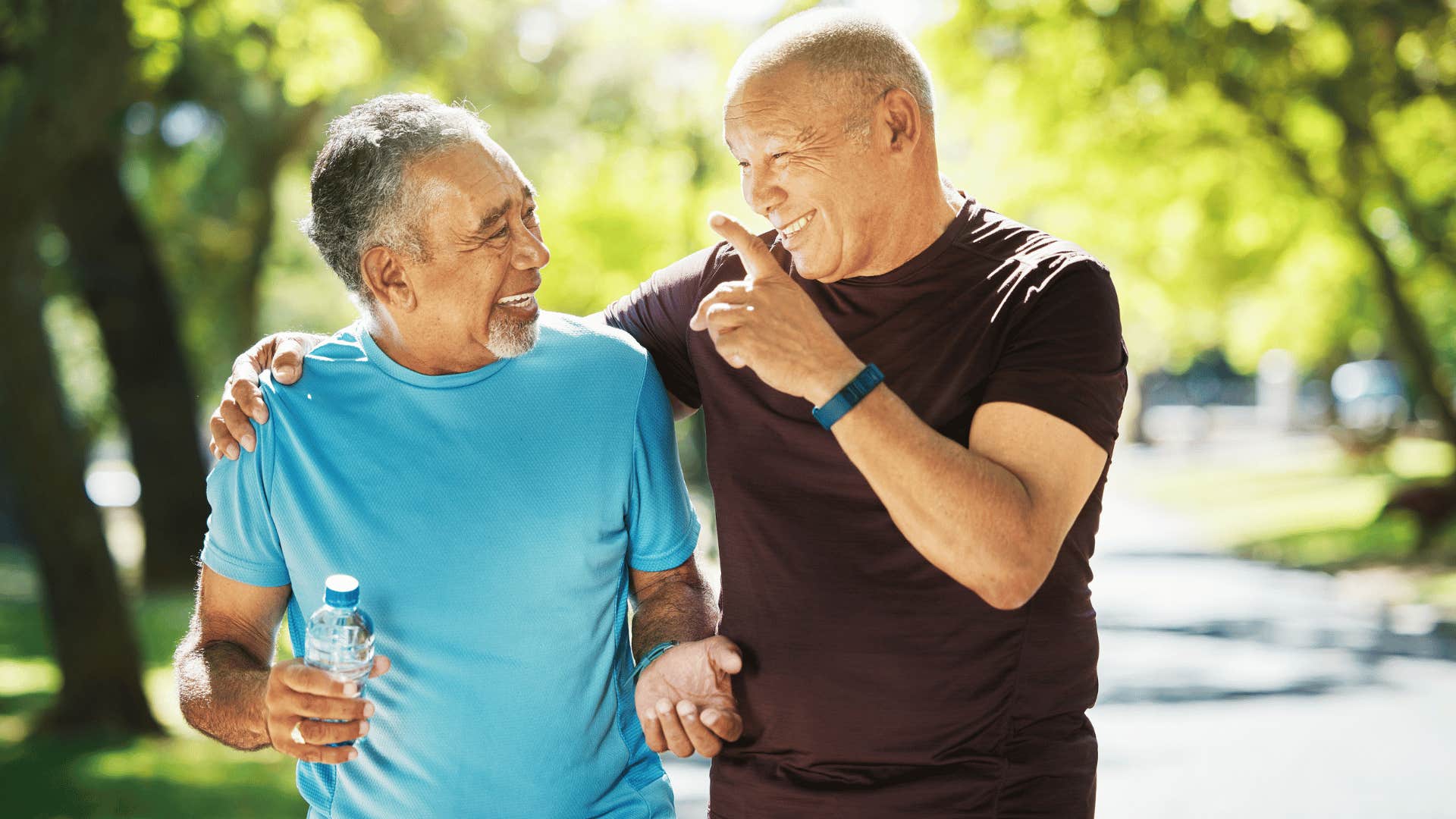 older friends laughing and walking together making jokes