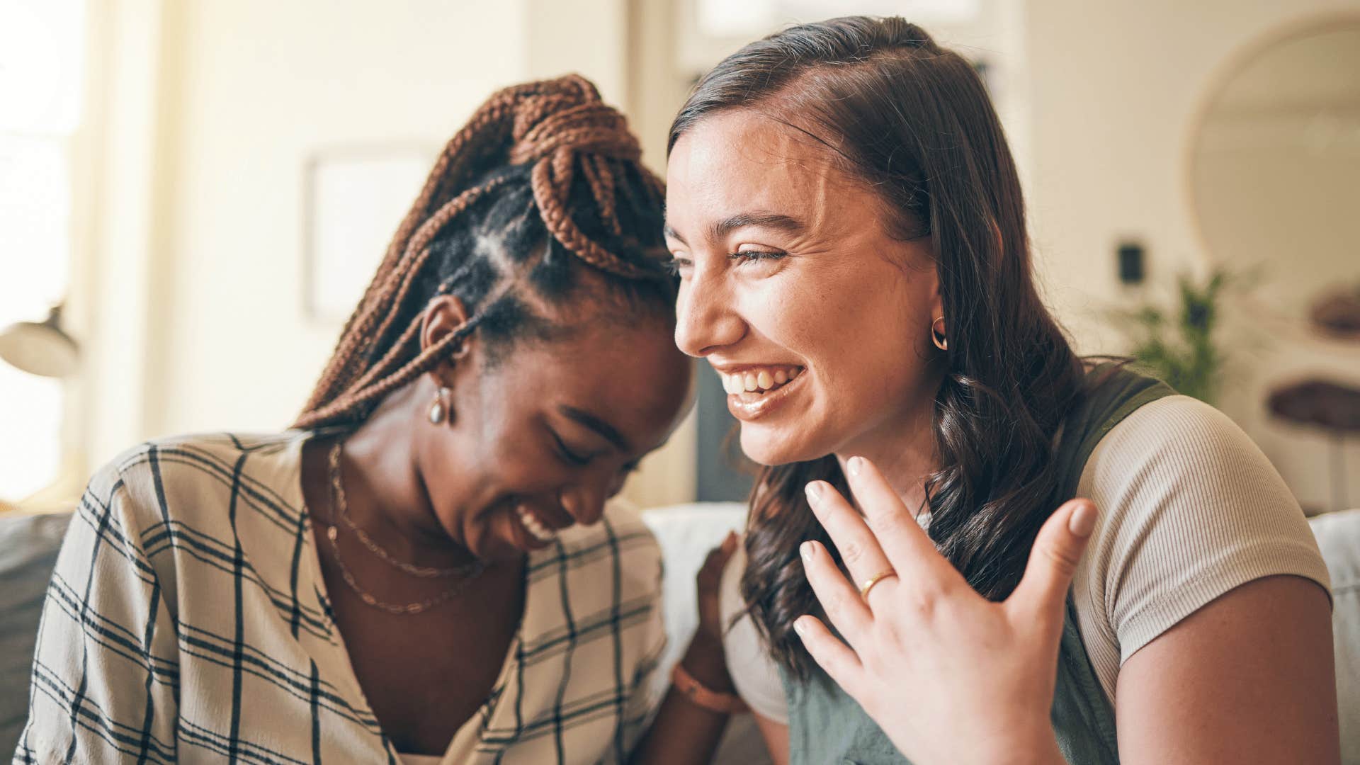 two friends laughing together over sarcastic conversation