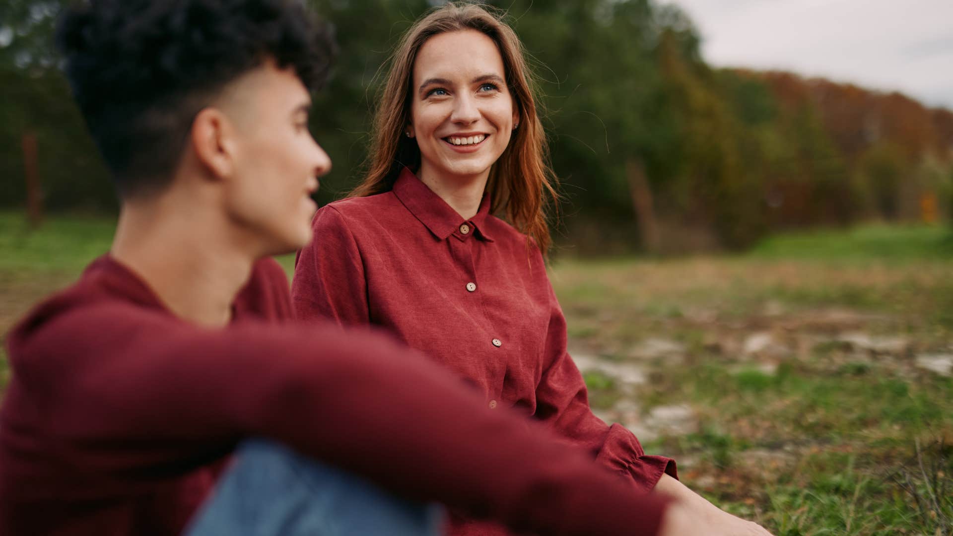 sarcastic woman smiling next to man saying i'm sure everything will be fine