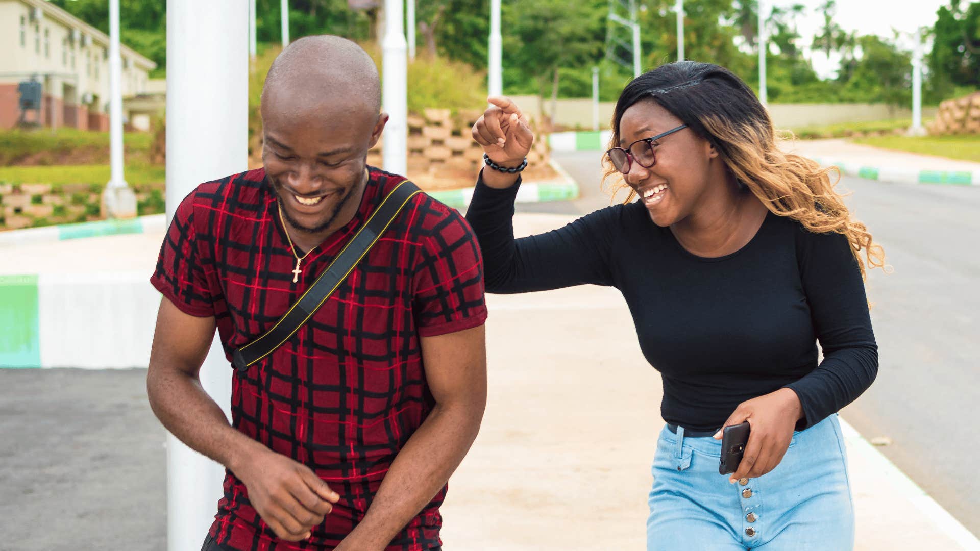 friends joking woman telling man youre a mess as they laugh
