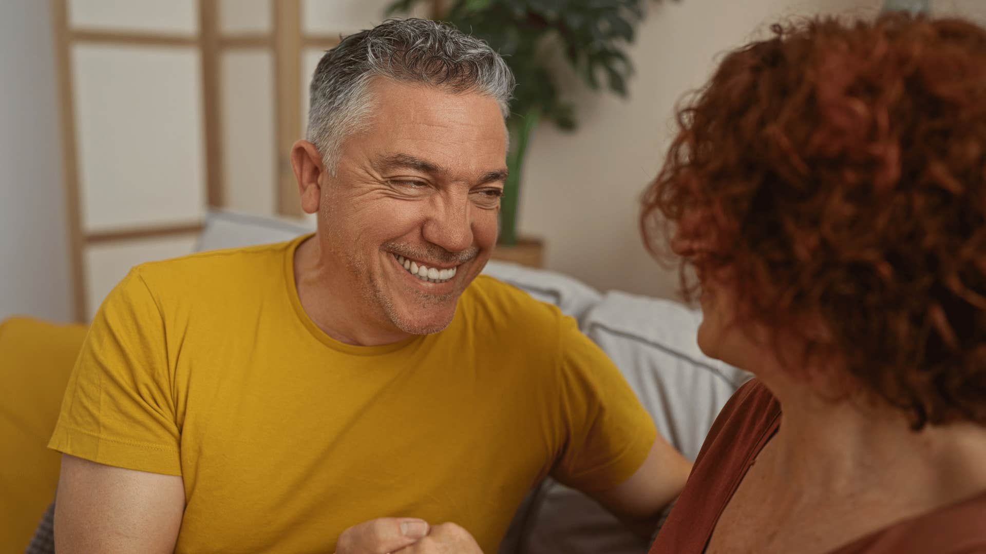 happy man sarcastically telling wife you're lucky i like you