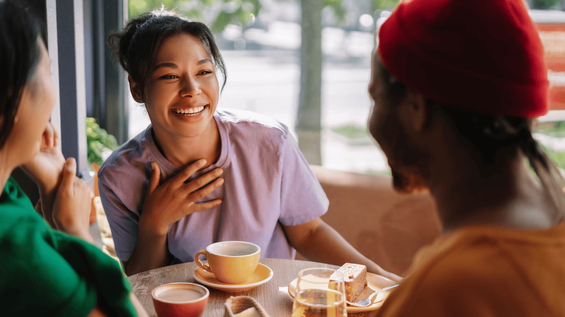 honest sarcastic woman joking with friends over brunch