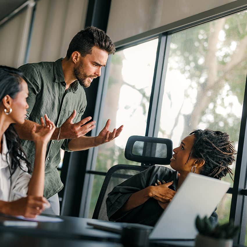 low iq man having tense social interaction with colleagues at work