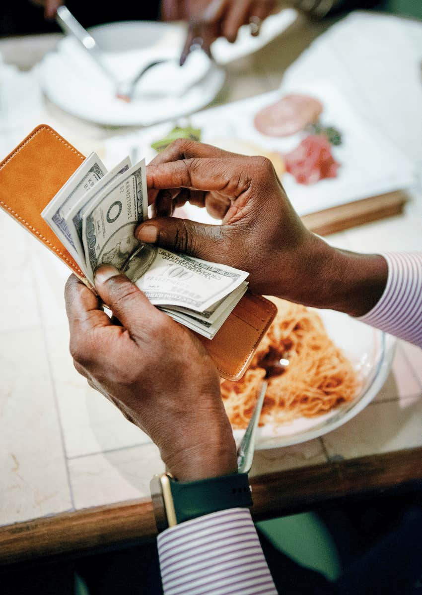 man at a restaurant over-tipping