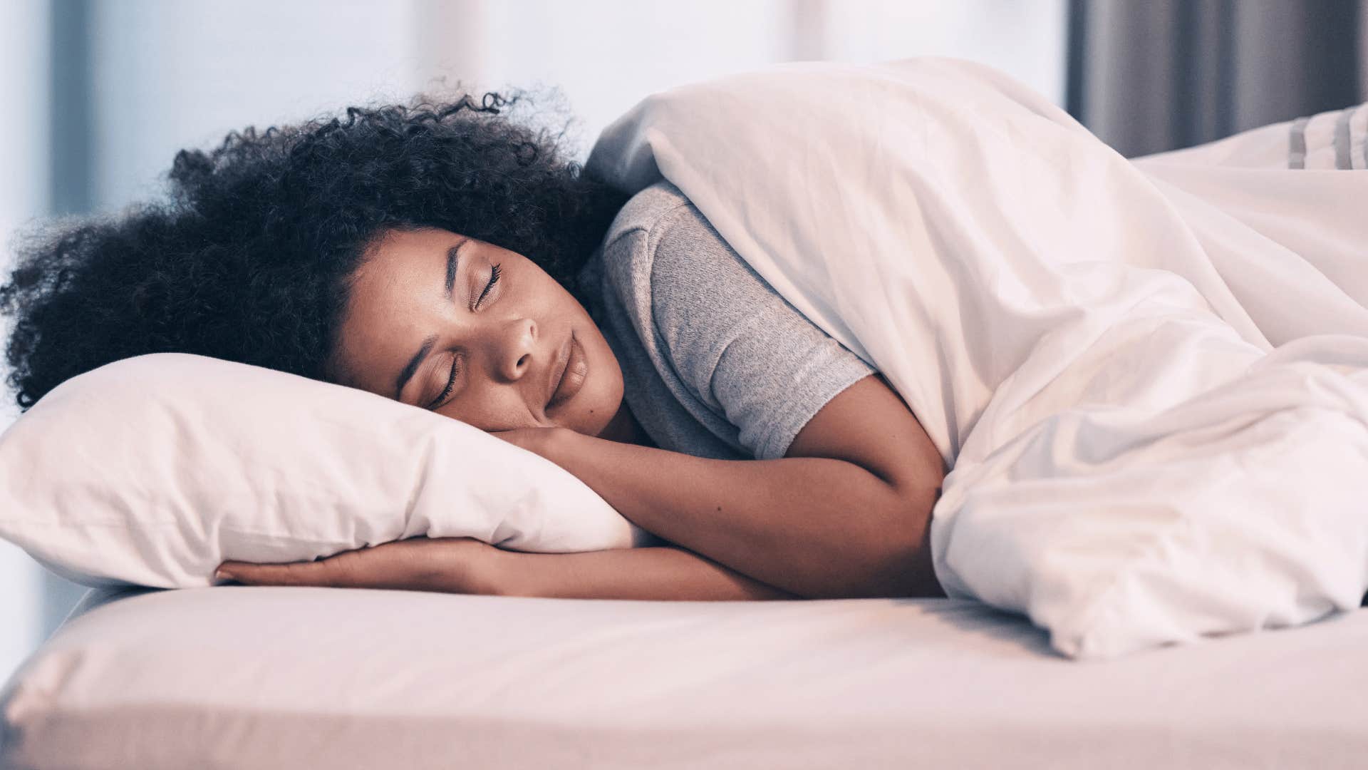 woman in bed sleeping a lot in bed